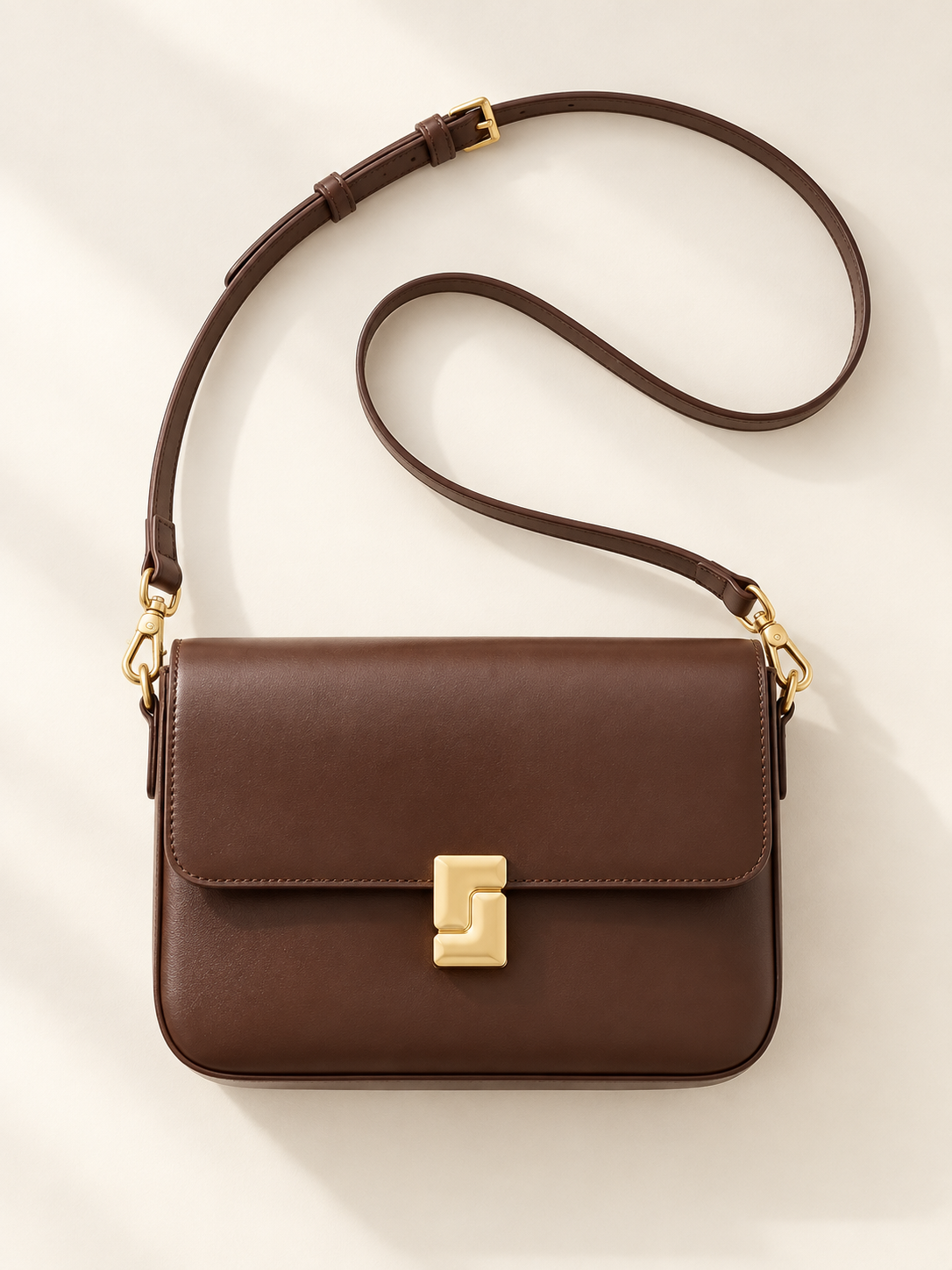Borsa a tracolla in pelle con chiusura dorata — Camille