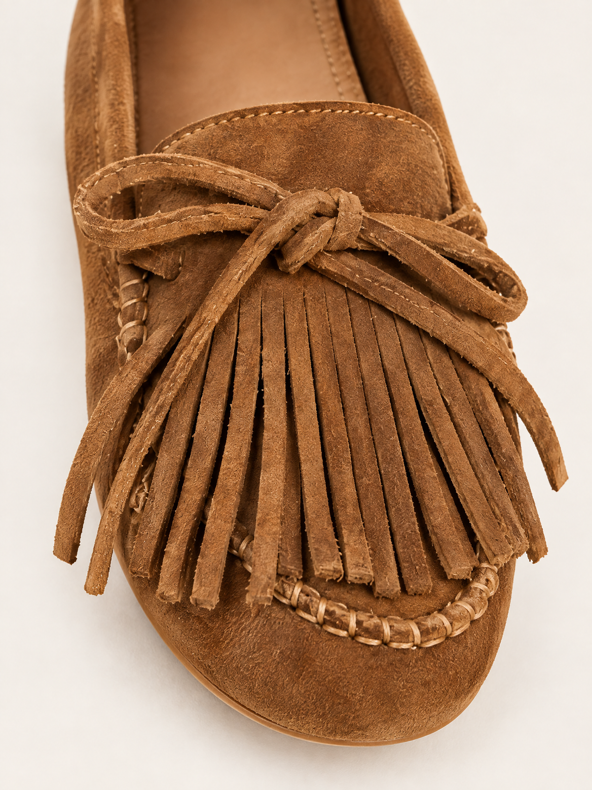 Cognac — 07 — Détail — franges et lacet noué